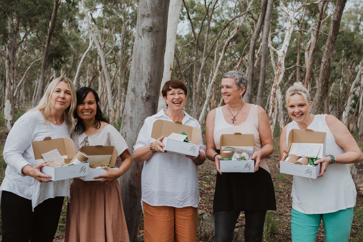 group of ladies holding nurture box